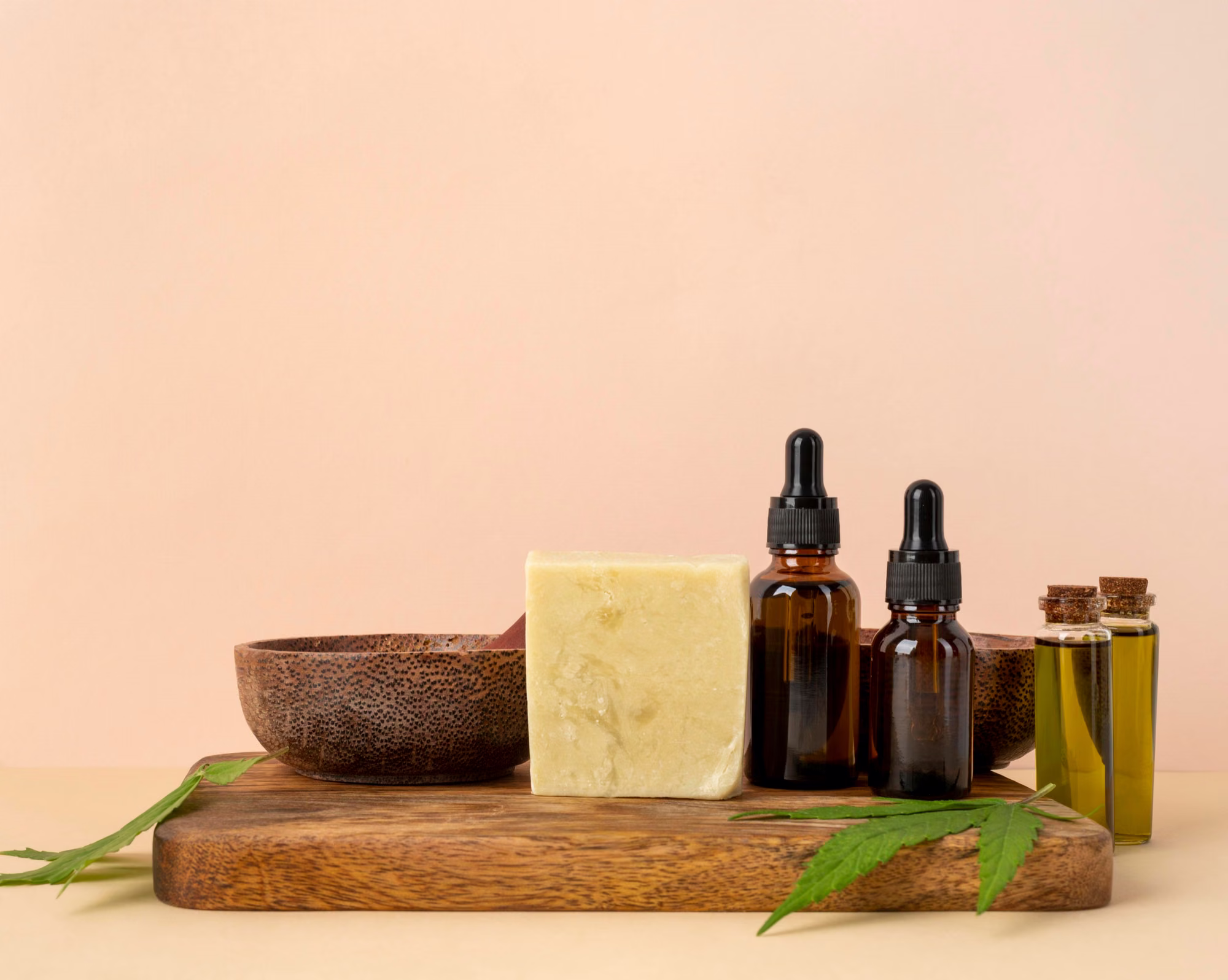 Essential oil bottles and natural soap bars arranged for soapmaking